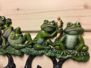 Coat rack with frogs